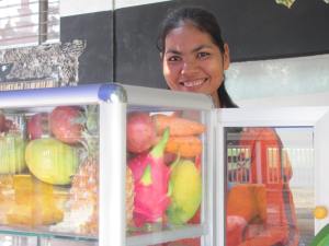 A friendly English-speaking entrepreneur selling delicious fruit shakes.