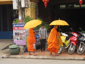 Monks doing their morning rounds for food or a donation.
