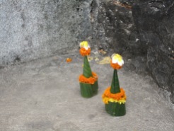 Little gifts made of marigold and bamboo leaves for Buddha.