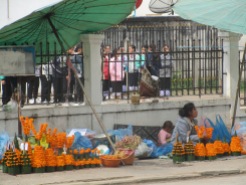 Women selling these flower tokens everywhere along the streets.